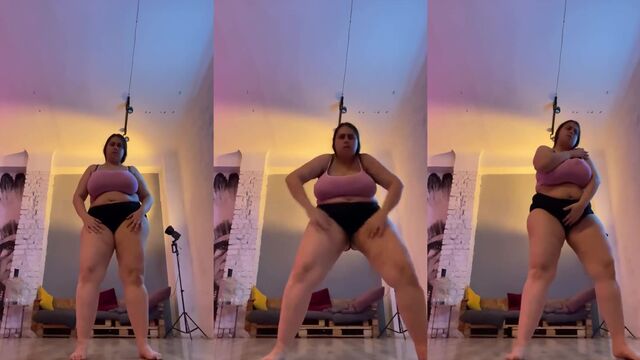 Chubby Russian dancer shows off her belly while shaking it with passion