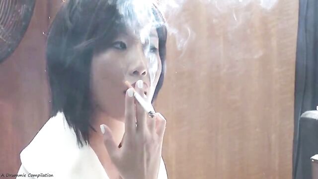 Asian teen smokes a cigarette before getting intimate in a steamy scene