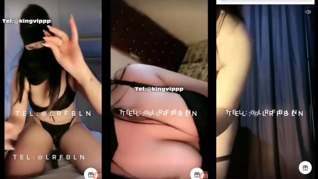 A sexy curvy woman wearing a hijab is doing tango and fucking herself
