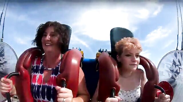 Accidental nip slip while riding a rollercoaster at the funfair