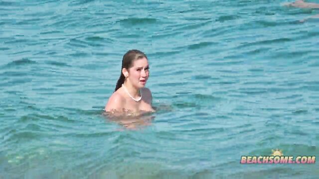 Topless beauty has sex on the public beach with voyeurs