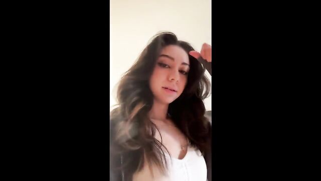 A petite Latina camgirl performs live on Twitch and TikTok