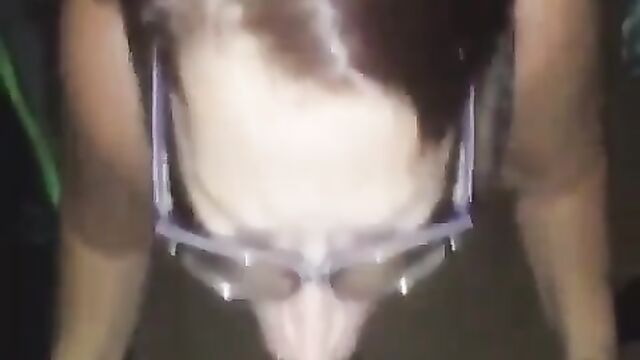 A mature woman with grey hair takes a huge black cock in her mouth