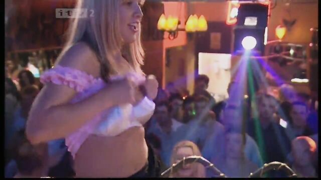 Topless European beauties caught basking in the sun on a beach